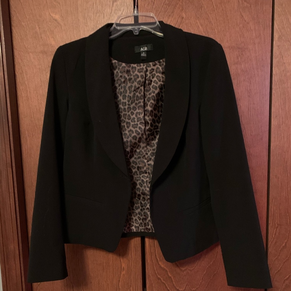 Black blazer with cheetah print inside
